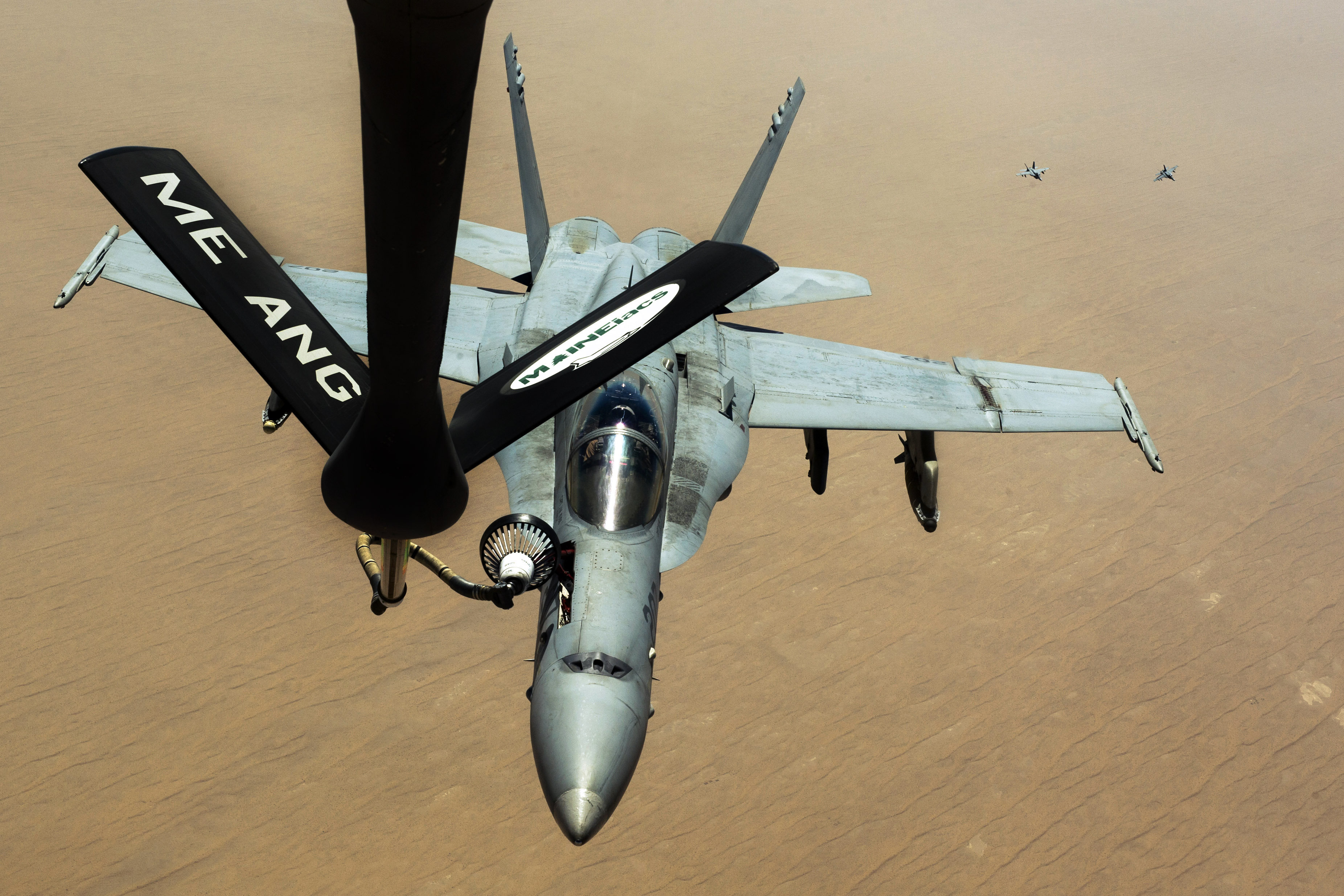 USMC FA-18C receives fuel from a USAF KC-135R over Afghanistan 2.jpg.