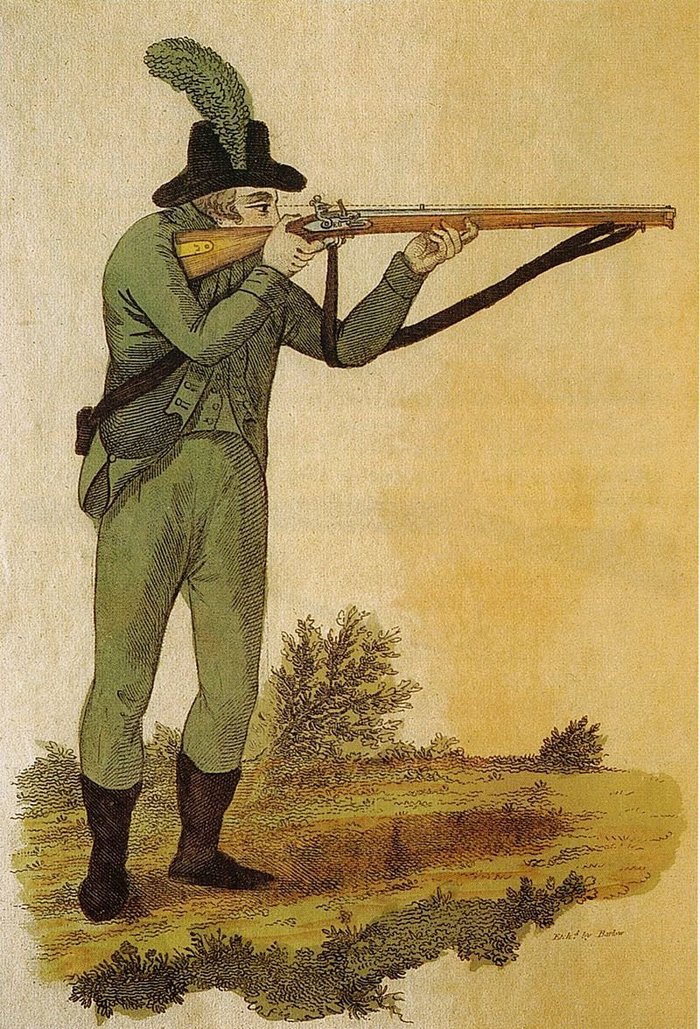1803년도의 영국군 라이플 연대원을 그린 그림. 당시의 화려한 군복과는 대조적인 녹색 군복을 입고 있으며 머리의 깃털도 모자의 윤곽을 가리는 효과가 있었다. <출처: Public Domain>